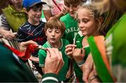 9 September 2024; Supporters, from left, Jeff, aged 10, Lila, aged 8, and Cúan Feelan, aged 7, look at a medal as Paralympics Ireland athletes arrive into Dublin on EI 525 from Paris with Aer Lingus, Official Airline Partner to Paralympics Ireland. The triumphant team were welcomed by an Aer Lingus guard of honour and were greeted by family, friends and supporters at arrivals. Aer Lingus is proud to have brought Team Ireland, thousands of supporters, and #HomeAdvantage to Paris throughout the competition. Photo by David Fitzgerald/Sportsfile