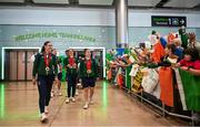 9 September 2024; Paralympics Ireland athletes, from left, Eve McCrystal, Katie-George Dunlevy and Linda Kelly on arrival into Dublin on EI 525 from Paris with Aer Lingus, Official Airline Partner to Paralympics Ireland. The triumphant team were welcomed by an Aer Lingus guard of honour and were greeted by family, friends and supporters at arrivals. Aer Lingus is proud to have brought Team Ireland, thousands of supporters, and #HomeAdvantage to Paris throughout the competition. Photo by David Fitzgerald/Sportsfile