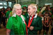 9 September 2024; Paralympics Ireland athlete Orla Comerford with Connie Corcoran, wife of coach Brian Corcoran, on arrival into Dublin on EI 525 from Paris with Aer Lingus, Official Airline Partner to Paralympics Ireland. The triumphant team were welcomed by an Aer Lingus guard of honour and were greeted by family, friends and supporters at arrivals. Aer Lingus is proud to have brought Team Ireland, thousands of supporters, and #HomeAdvantage to Paris throughout the competition. Photo by David Fitzgerald/Sportsfile