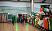 9 September 2024; Paralympics Ireland athletes Orla Comerford, left, and Róisín Ní Riain on arrival into Dublin on EI 525 from Paris with Aer Lingus, Official Airline Partner to Paralympics Ireland. The triumphant team were welcomed by an Aer Lingus guard of honour and were greeted by family, friends and supporters at arrivals. Aer Lingus is proud to have brought Team Ireland, thousands of supporters, and #HomeAdvantage to Paris throughout the competition. Photo by David Fitzgerald/Sportsfile