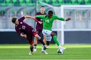 10 September 2024; Aidomo Emakhu of Republic of Ireland in action against Ralfs Maslovs of Latvia during the UEFA European U21 Championship qualifier match between Republic of Ireland and Latvia at Tallaght Stadium in Dublin. Photo by Tyler Miller/Sportsfile