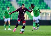 10 September 2024; Aidomo Emakhu of Republic of Ireland in action against Roberts Melkis of Latvia during the UEFA European U21 Championship qualifier match between Republic of Ireland and Latvia at Tallaght Stadium in Dublin. Photo by Tyler Miller/Sportsfile