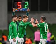 10 September 2024; Kasey McAteer of Republic of Ireland comes onto the pitch during a substitution to replace Jason Knight, right, as Matt Doherty, left, waits to also come on during the UEFA Nations League B Group 2 match between Republic of Ireland and Greece at Aviva Stadium in Dublin. Photo by Stephen McCarthy/Sportsfile