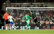 10 September 2024; Greece goalkeeper Odysseas Vlachodimos gets a touch on the ball from Chiedozie Ogbene of Republic of Ireland, not pictured, for his side's first goal which is subsequently ruled offside during the UEFA Nations League B Group 2 match between Republic of Ireland and Greece at Aviva Stadium in Dublin. Photo by Michael P Ryan/Sportsfile