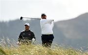 12 September 2024; Shane Lowry of Ireland takes a shot, watched by Ryan Fox of New Zealand during day one of the Amgen Irish Open Golf Championship 2024 at the Royal County Down Golf Club in Newcastle, Down. Photo by Brendan Moran/Sportsfile
