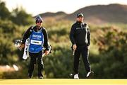 13 September 2024; Shane Lowry of Ireland with his caddy Darren Reynolds on the 15th fairway during day two of the Amgen Irish Open Golf Championship 2024 at the Royal County Down Golf Club in Newcastle, Down. Photo by Ramsey Cardy/Sportsfile