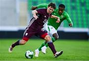 10 September 2024; Ralfs Maslovs of Latvia in action against Aidomo Emakhu of Republic of Ireland during the UEFA European U21 Championship qualifier match between Republic of Ireland and Latvia at Tallaght Stadium in Dublin. Photo by Tyler Miller/Sportsfile