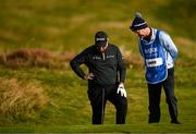 13 September 2024; Shane Lowry of Ireland and his caddie Darren Reynolds check their lie at the 17th  green during day two of the Amgen Irish Open Golf Championship 2024 at the Royal County Down Golf Club in Newcastle, Down. Photo by Brendan Moran/Sportsfile