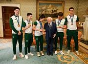 13 September 2024; President of Ireland Michael D Higgins poses for a photograph with Team Ireland medalists, from left, rowing bronze medalist Daire Lynch, gymnastics gold medalist Rhys McClenaghan, boxing gold medalist Kellie Harrington, rowing gold medalist Fintan McCarthy and rowing bronze medalist Philip Doyle during the Team Ireland homecoming at Áras an Uachtaráin in Dublin. Photo by David Fitzgerald/Sportsfile