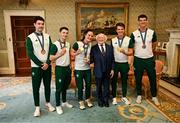 13 September 2024; President of Ireland Michael D Higgins poses for a photograph with Team Ireland medalists, from left, rowing bronze medalist Daire Lynch, gymnastics gold medalist Rhys McClenaghan, boxing gold medalist Kellie Harrington, rowing gold medalist Fintan McCarthy and rowing bronze medalist Philip Doyle during the Team Ireland homecoming at Áras an Uachtaráin in Dublin. Photo by David Fitzgerald/Sportsfile