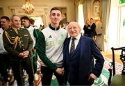 13 September 2024; Team Ireland taekwondo athlete Jack Woolley poses for a photograph with The President of Ireland Michael D Higgins during the Team Ireland homecoming at Áras an Uachtaráin in Dublin. Photo by David Fitzgerald/Sportsfile