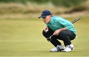 14 September 2024; Seán Keeling of Ireland lines up a putt on the fourth green during day three of the Amgen Irish Open Golf Championship 2024 at the Royal County Down Golf Club in Newcastle, Down. Photo by Ramsey Cardy/Sportsfile