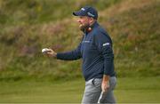 14 September 2024; Shane Lowry of Ireland acknowledges the gallery after a birdie putt on the first green during day three of the Amgen Irish Open Golf Championship 2024 at the Royal County Down Golf Club in Newcastle, Down. Photo by Brendan Moran/Sportsfile