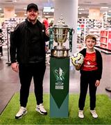 14 September 2024; Sean McCann, left, with his step-son Shea Doherty, age 7, at the Sports Direct Men’s FAI Cup Trophy Tour at Sports Direct, Derry, ahead of the Sports Direct Men’s FAI Cup Quarter Final Match between Derry City and Shelbourne at the Ryan McBride Brandywell Stadium in Derry. Photo by Ben McShane/Sportsfile