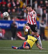14 September 2024; Danny Mullen of Derry City is tackled by Mark Coyle of Shelbourne during the Sports Direct Men's FAI Cup Quarter Final match between Derry City and Shelbourne at the The Ryan McBride Brandywell Stadium in Derry. Photo by Ben McShane/Sportsfile