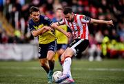 14 September 2024; Michael Duffy of Derry City scores his side's first goal despite the attention of Tyreke Wilson of Shelbourne during the Sports Direct Men's FAI Cup Quarter Final match between Derry City and Shelbourne at the The Ryan McBride Brandywell Stadium in Derry. Photo by Ben McShane/Sportsfile