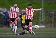 14 September 2024; Danny Mullen of Derry City is tackled by Mark Coyle of Shelbourne during the Sports Direct Men's FAI Cup Quarter Final match between Derry City and Shelbourne at the The Ryan McBride Brandywell Stadium in Derry. Photo by Ben McShane/Sportsfile