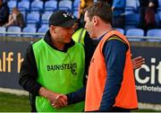 14 September 2024; Lucan Sarsfields manager Charlie Carter, left, and Na Fianna manager Niall O Ceallachain after the Dublin Senior 1 Hurling Championship Group 1 match between Lucan and Na Fianna at Parnell Park in Dublin. Photo by Stephen Marken/Sportsfile