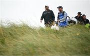 15 September 2024; Shane Lowry of Ireland with his caddy Darren Reynolds as they make their way from the second tee box during day four of the Amgen Irish Open Golf Championship 2024 at the Royal County Down Golf Club in Newcastle, Down. Photo by Ramsey Cardy/Sportsfile
