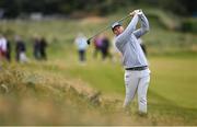 15 September 2024; Seamus Power of Ireland watches his shot from the rough on the first fairway during day four of the Amgen Irish Open Golf Championship 2024 at the Royal County Down Golf Club in Newcastle, Down. Photo by Ramsey Cardy/Sportsfile