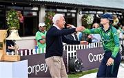 15 September 2024; Former Ireland cricketer Alan Lewis with his daughter Ireland captain Gaby Lewis after ringing the Roy Torrens bell before match two of the Women's T20 International Series between Ireland and England at Clontarf in Dublin. Photo by Piaras Ó Mídheach/Sportsfile
