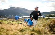 15 September 2024; Rory McIlroy of Northern Ireland walks to the 11th fairway during day four of the Amgen Irish Open Golf Championship 2024 at the Royal County Down Golf Club in Newcastle, Down. Photo by Ramsey Cardy/Sportsfile