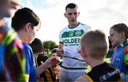 15 September 2024; Eoin Cody of Shamrocks Ballyhale talks to young supporters after his side's victory in the Kilkenny Senior Hurling Championship Relegation Semi-Final match between James Stephens and Shamrocks Ballyhale at John Locke Park, Callan in Kilkenny. Photo by Shauna Clinton/Sportsfile