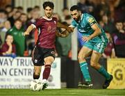 16 September 2024; Jimmy Keohane of Galway United in action against Roberto Lopes of Shamrock Rovers during the SSE Airtricity Men's Premier Division match between Galway United and Shamrock Rovers at Eamonn Deacy Park in Galway. Photo by Piaras Ó Mídheach/Sportsfile