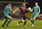 16 September 2024; Stephen Walsh of Galway United in action against Roberto Lopes, left, and Gary O'Neill of Shamrock Rovers during the SSE Airtricity Men's Premier Division match between Galway United and Shamrock Rovers at Eamonn Deacy Park in Galway. Photo by Piaras Ó Mídheach/Sportsfile