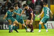 16 September 2024; Patrick Hickey of Galway United in action against Shamrock Rovers players, from left, Roberto Lopes, Dylan Watts and Gary O'Neill during the SSE Airtricity Men's Premier Division match between Galway United and Shamrock Rovers at Eamonn Deacy Park in Galway. Photo by Piaras Ó Mídheach/Sportsfile