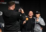 19 September 2024; Thomas Carty takes a photo of UFC president Dana White with a supporter at the 3Arena in Dublin, ahead of Walsh vs Runowski tomorrow night. Photo by David Fitzgerald/Sportsfile