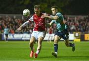 20 September 2024; Mason Melia of St Patrick's Athletic in action against Darragh Leahy of Waterford during the SSE Airtricity Men's Premier Division match between St Patrick's Athletic and Waterford at Richmond Park in Dublin. Photo by Shauna Clinton/Sportsfile