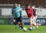 20 September 2024; Kian Leavy of St Patrick's Athletic in action against Rowan McDonald of Waterford during the SSE Airtricity Men's Premier Division match between St Patrick's Athletic and Waterford at Richmond Park in Dublin. Photo by Shauna Clinton/Sportsfile