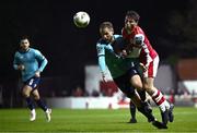 20 September 2024; Kian Leavy of St Patrick's Athletic in action against Rowan McDonald of Waterford during the SSE Airtricity Men's Premier Division match between St Patrick's Athletic and Waterford at Richmond Park in Dublin. Photo by Shauna Clinton/Sportsfile