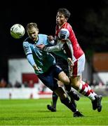 20 September 2024; Kian Leavy of St Patrick's Athletic in action against Rowan McDonald of Waterford during the SSE Airtricity Men's Premier Division match between St Patrick's Athletic and Waterford at Richmond Park in Dublin. Photo by Shauna Clinton/Sportsfile