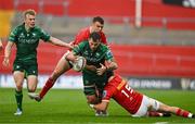 21 September 2024; Conor Oliver of Connacht is tackled by Tom Farrell and Mike Haley of Munster during the United Rugby Championship match between Munster and Connacht at Thomond Park in Limerick. Photo by Brendan Moran/Sportsfile