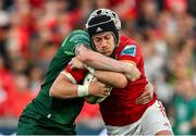 21 September 2024; Mike Haley of Munster is tackled by Mack Hansen of Connacht during the United Rugby Championship match between Munster and Connacht at Thomond Park in Limerick. Photo by Brendan Moran/Sportsfile