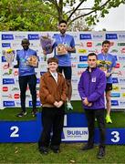 22 September 2024; Men's top 3 finishers, from left, second place Peter Somba of Ratoath AC, Dublin, first place Hugh Armstrong of Ballina AC, Mayo, and third place David Glynn, with Patrick Ryan, Managing Director of Irish Life Advice Solutions, right, and Mark Winters, designer of the Irish Life Dublin Half Marathon medal presenting medals to the finishers.  A talented student and artist from NCAD he created an intricately designed medal featuring the diverse wildlife of Phoenix Park. The standout feature of the medal is a beautiful depiction of a majestic deer, which is a symbol of Phoenix Park during the 2024 Irish Life Dublin Half Marathon which took place on Sunday 22nd of September in Phoenix Park, Dublin. Photo by Sam Barnes/Sportsfile