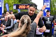 22 September 2024; David Fizgerald celebrates with his partner Anna O'Neill after they finished the 2024 Irish Life Dublin Half Marathon which took place on Sunday 22nd of September in Phoenix Park, Dublin. Photo by Sam Barnes/Sportsfile