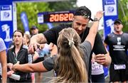 22 September 2024; David Fizgerald celebrates with his partner Anna O'Neill after they finished the 2024 Irish Life Dublin Half Marathon which took place on Sunday 22nd of September in Phoenix Park, Dublin. Photo by Sam Barnes/Sportsfile