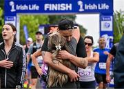 22 September 2024; David Fizgerald celebrates with his partner Anna O'Neill after they finished the 2024 Irish Life Dublin Half Marathon which took place on Sunday 22nd of September in Phoenix Park, Dublin. Photo by Sam Barnes/Sportsfile