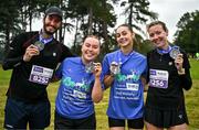 22 September 2024; Participants, from left, Alan Szezur, Joanna Kleiner, Kerri Williams and Mathilde Szezur after finishing the 2024 Irish Life Dublin Half Marathon which took place on Sunday 22nd of September in Phoenix Park, Dublin. Photo by Sam Barnes/Sportsfile