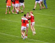 22 September 2024; Sean Canning of Pádraig Pearses, centre, celebrates with team-mates Conor Ryan, 8, and Jack Nevin after their side's victory in the Roscommon Senior Club Football Championship quarter-final match between St Brigid's and Pádraig Pearses at Dr Hyde Park in Roscommon. Photo by Piaras Ó Mídheach/Sportsfile