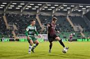 23 September 2024; Paddy Kirk of Bohemians in action against Darragh Burns of Shamrock Rovers during the SSE Airtricity Men's Premier Division match between Shamrock Rovers and Bohemians at Tallaght Stadium in Dublin. Photo by Piaras Ó Mídheach/Sportsfile