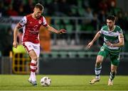 27 September 2024; Jamie Lennon of St Patrick's Athletic in action against Neil Farrugia of Shamrock Rovers during the SSE Airtricity Men's Premier Division match between Shamrock Rovers and St Patrick's Athletic at Tallaght Stadium in Dublin. Photo by Piaras Ó Mídheach/Sportsfile
