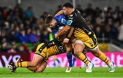 27 September 2024; Ross Byrne of Leinster is tackled by Rodrigo Martinez, left, and Chris Coleman of Dragons during the United Rugby Championship match between Leinster and Dragons at the Aviva Stadium in Dublin. Photo by Shauna Clinton/Sportsfile