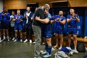 27 September 2024; Cian Healy of Leinster is presented with a special cap by previous cap record holder Devin Toner, right, after the United Rugby Championship match between Leinster and Dragons at the Aviva Stadium in Dublin. Photo by Brendan Moran/Sportsfile