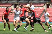 28 September 2024; Stuart McCloskey of Ulster is tackled by Kade Wolhuter and Rabz Maxwane of Emirates Lions during the United Rugby Championship match between Emirates Lions and Ulster at Emirates Airline Park in Johannesburg, South Africa. Photo by Shaun Roy/Sportsfile