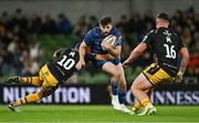 27 September 2024; Harry Byrne of Leinster is tackled by Lloyd Evans of Dragons during the United Rugby Championship match between Leinster and Dragons at the Aviva Stadium in Dublin. Photo by Brendan Moran/Sportsfile
