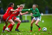 28 September 2024; Ella Kelly of Republic of Ireland in action against Nia Lewis of Cymru during the women's U17 international friendly match between Republic of Ireland and Cymru at the AUL Complex in Clonsaugh, Dublin. Photo by Shauna Clinton/Sportsfile